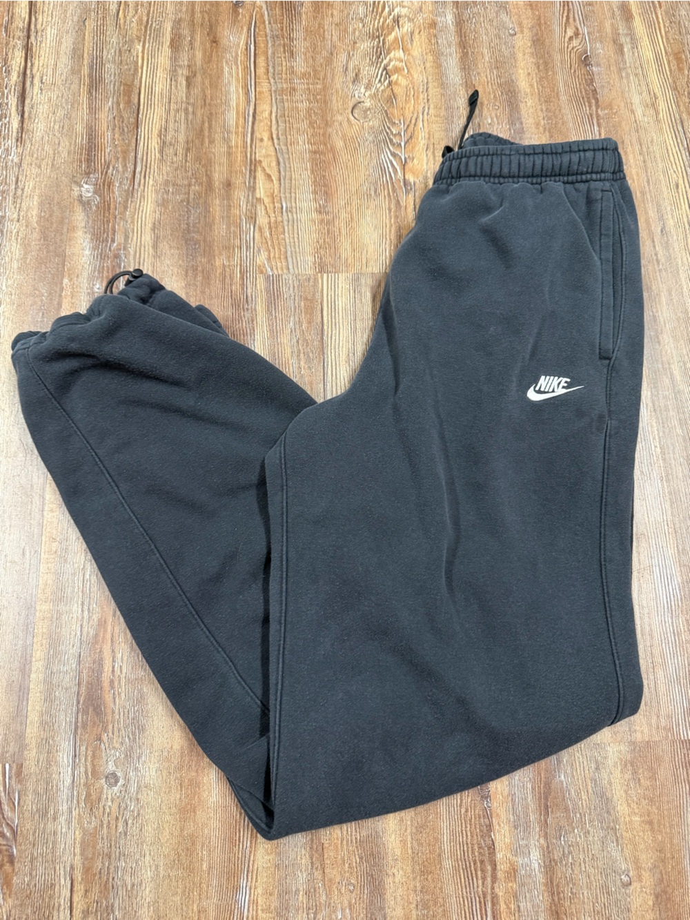 Nike black sweatpants with white logo, size S